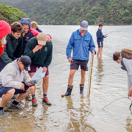 Testing temperature, pH, dissolved oxygen levels, salinity and other parameters using the YSI multimeter, whilst Nick Chamberlain fishes in the background! (photo: Barry Kelk)