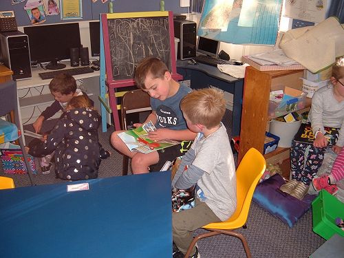 Toby and Eli enjoying a story together.