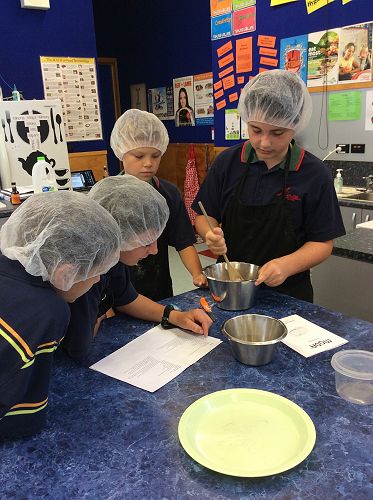 Year 8 boys carefully following the instructions for one of their technological products.