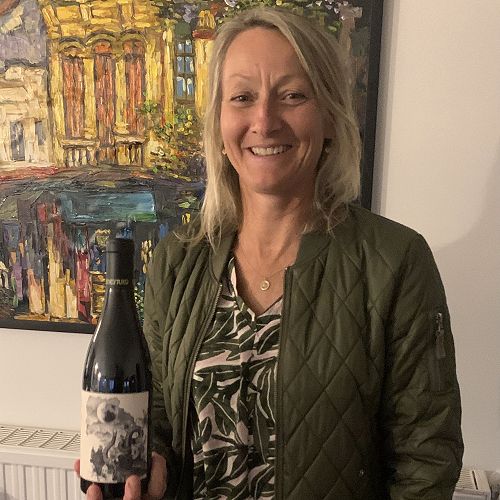 Claire Mulholland with the fabulous wine she makes at Burn Cottage Vineyard...