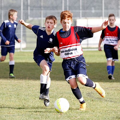 Reuben Cook wins the ball in a centre-mid-field battle in the Waihi Exchange Football Game