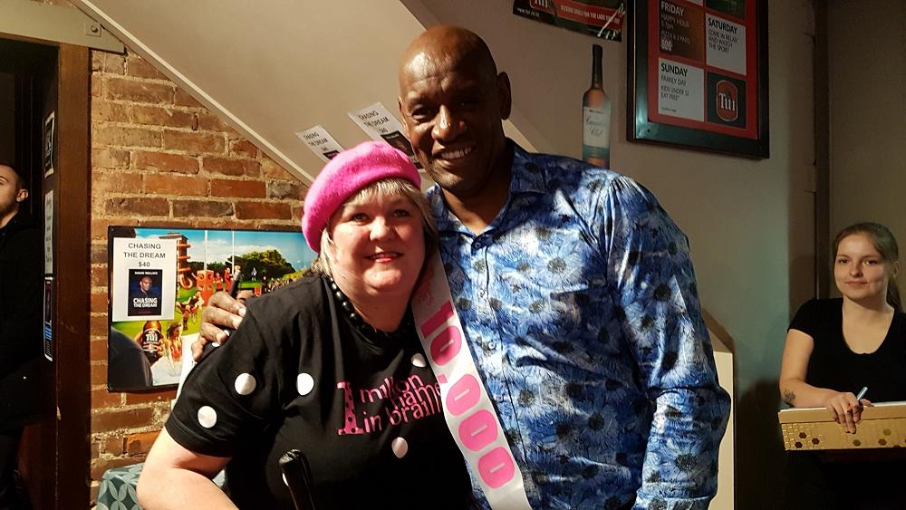 Julie gives the Dark Destroyer his 10,000 names in braille sash!