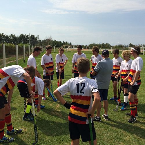 Half time talk, classic grass hockey game