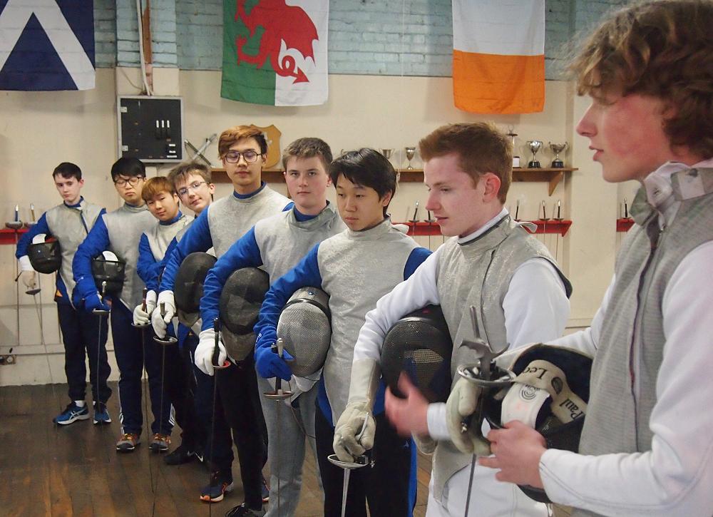 The McGlashan fencers suited up with weapons, masks and lam&eacute;s.