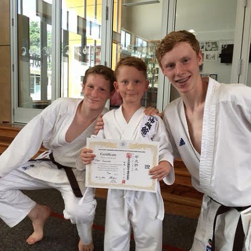 Riley and Keegan Hall celebrate the karate success of one of their primary school students&nbsp;