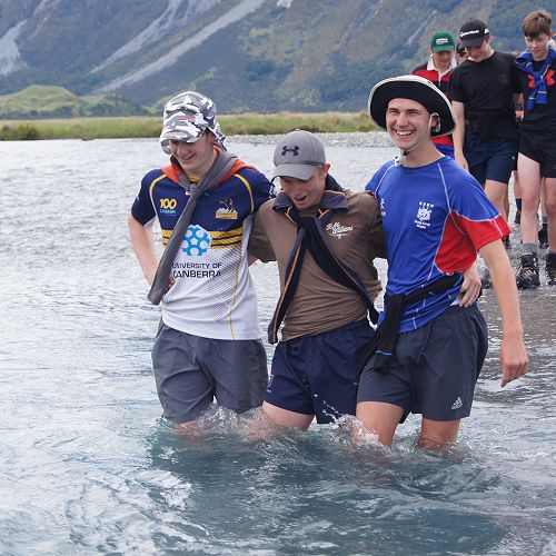 Sam, Andrew and Caleb crossing a braid of the Huxley River