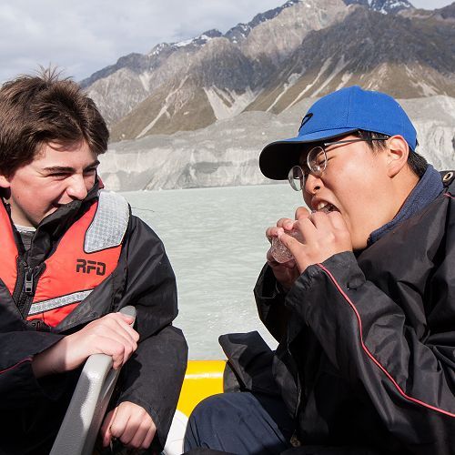 Alex Leckie-Zaharic looks on as Jin Kim munches into an Ice-Burger. Nothing but gourmet food on Year 10 camp.