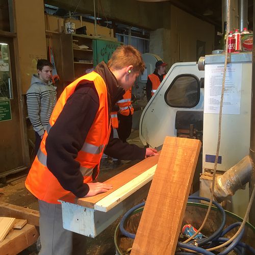 Zach White has a go with the machines at Wood Solutions