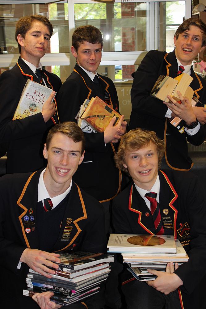 Senior Librarians help shelve some of the 2390 books which were returned after the College's Summer Reading Programme.&nbsp;