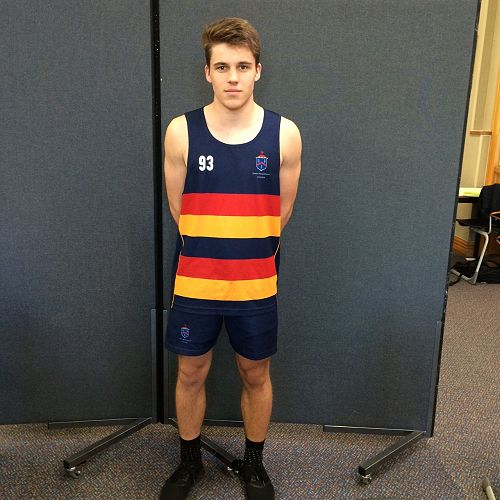 Sean Duff is modeling the generic singlet and shorts that most basketball teams will wear. The first team is in white. Junior A, B and senior B wear a specific basketball short with the same singlet as Sean has.