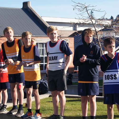 Y7&8 students cheer for older students at the finish line