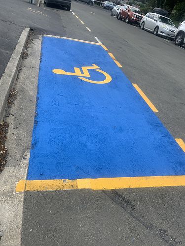 New road markings at the front of the school. Please only park here if you have a mobility card.