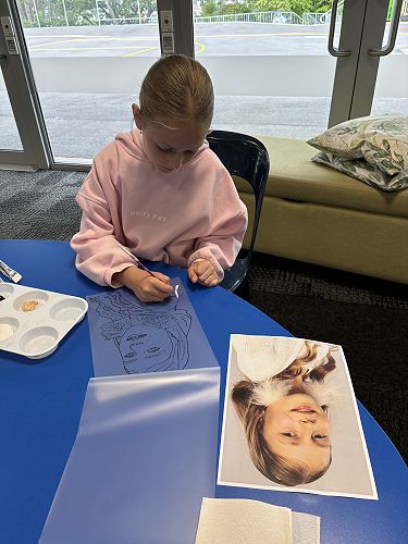 Self-Portraits using paint and laminating sheets.