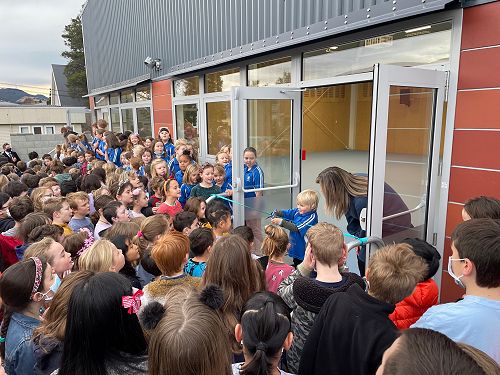 Ezra our youngest pupil cuts the ribbon! 