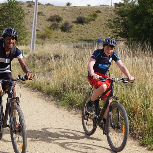 Krishan and Luka ride towards Kokonga