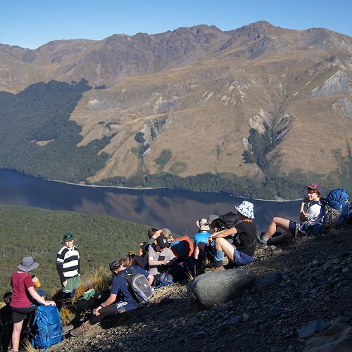 The group pauses for a break during the climb to the saddle
