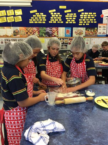 Team work! Wearing the special red aprons because they were 'Kitchen of the Day'.