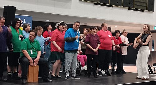 Simon singing at the Next Steps Expo