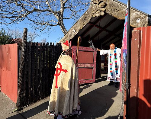 The gate to Te Hepara Pai at Ferry Road is opened for Bishop Susan Wallace.