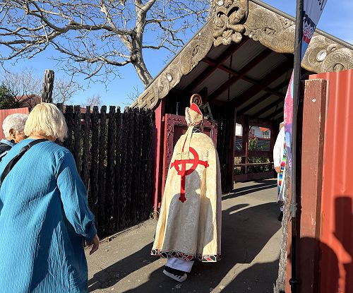 At a kaikaranga, Bishop Susan Wallace and her whānau, including visitors are called toward Te Hepara Pai at Ferry Road for the Sunday church service.