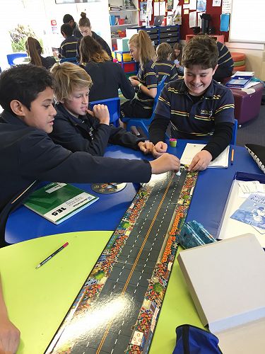 Weshaven, Luke and Jeremy enjoy the measuring marathon game.