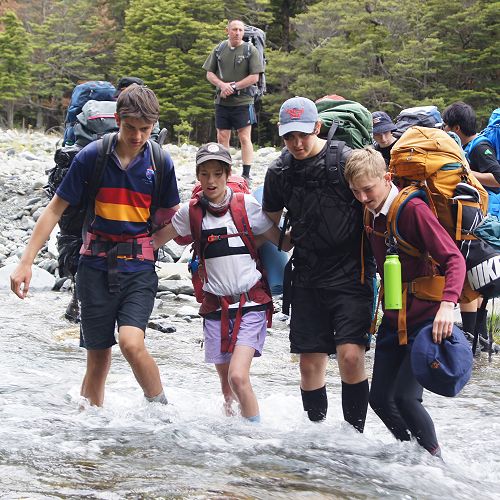 Bailey, Ben, Caine and Cam cross the Temple North Branch at the start of the tramp