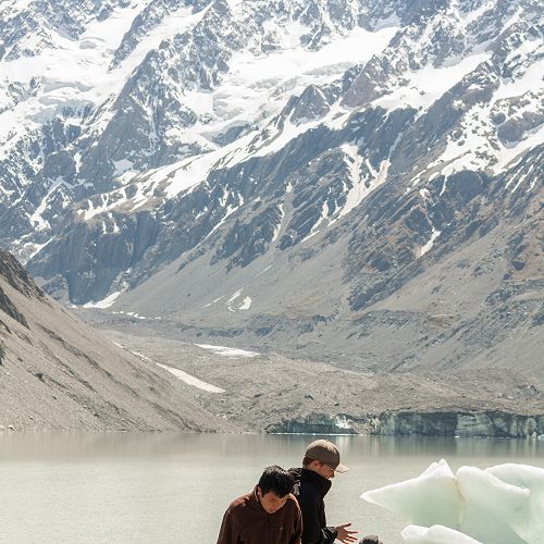 A lazy afternoon in the sun on the shore of the Hooker Glacier terminal lake looking up to Aoraki Mt Cook.&nbsp;