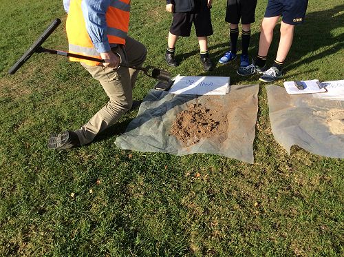 Emptying the core samples out.