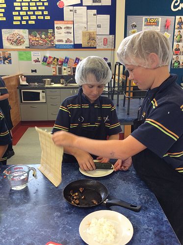 The careful construction of a sushi roll