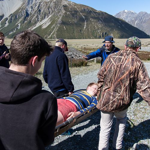 Sam Engelbrecht is carried in a SAR exercise by classmates.&nbsp;