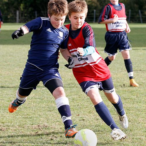 Sebastian Kyle fights for the ball in a centre-mid-field battle in the Waihi Exchange Football Game