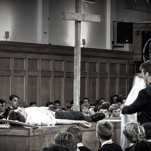 'Jesus' (Joe Garry) is wrapped in linen cloth by Rory Ferguson &nbsp;2016 Easter service in the Chapel.